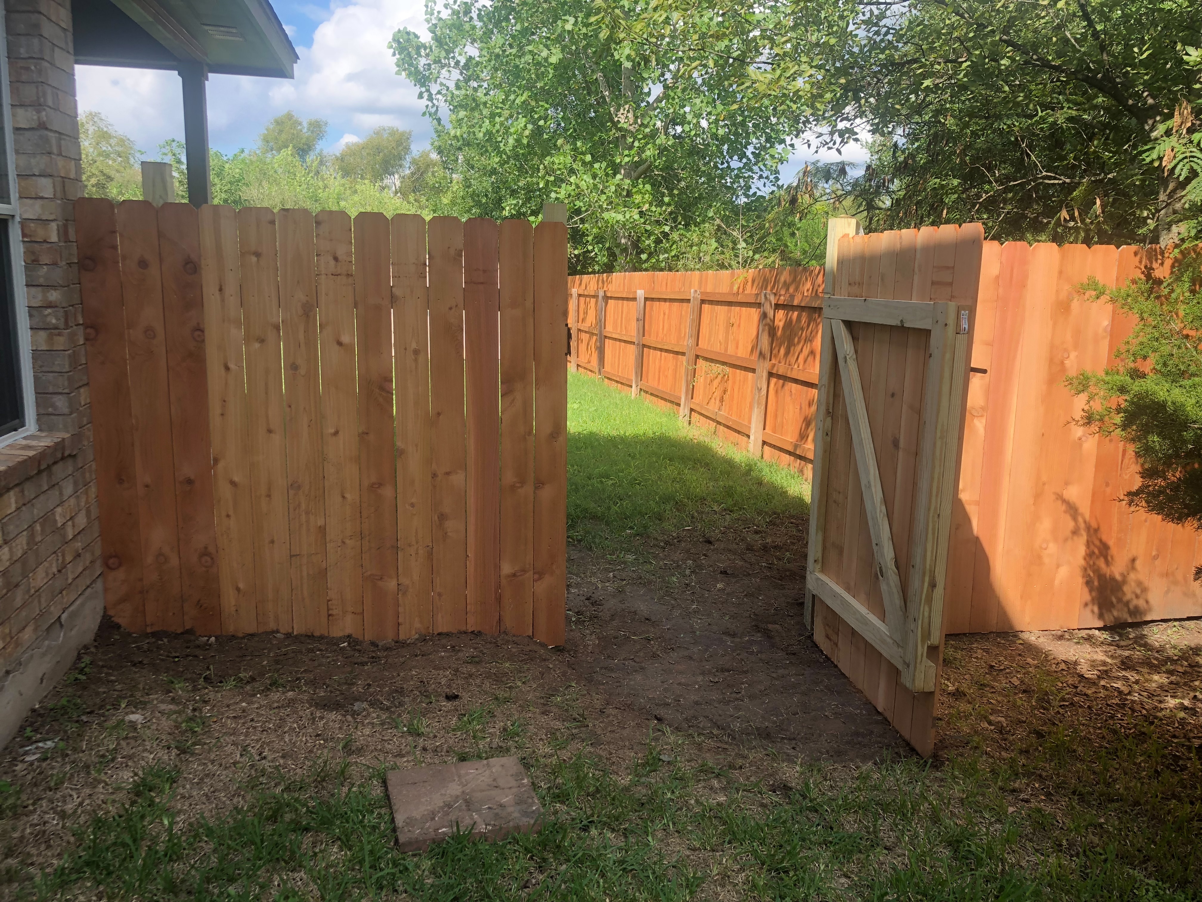 New cedar fence installation