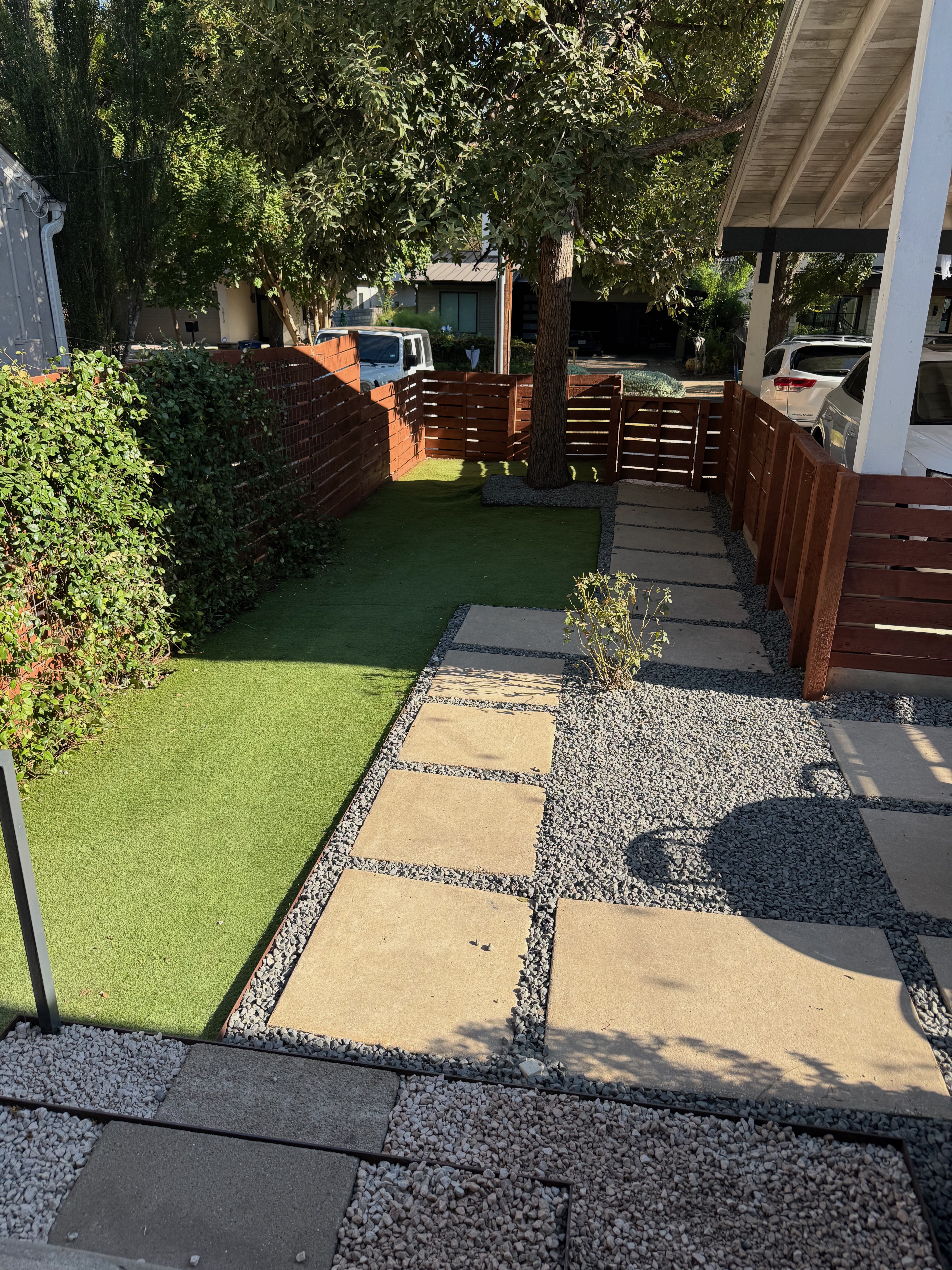 Modern horizontal fence with landscaping