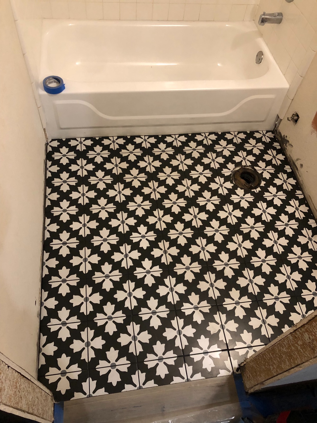 Black and white floral cement tile bathroom floor Austin TX