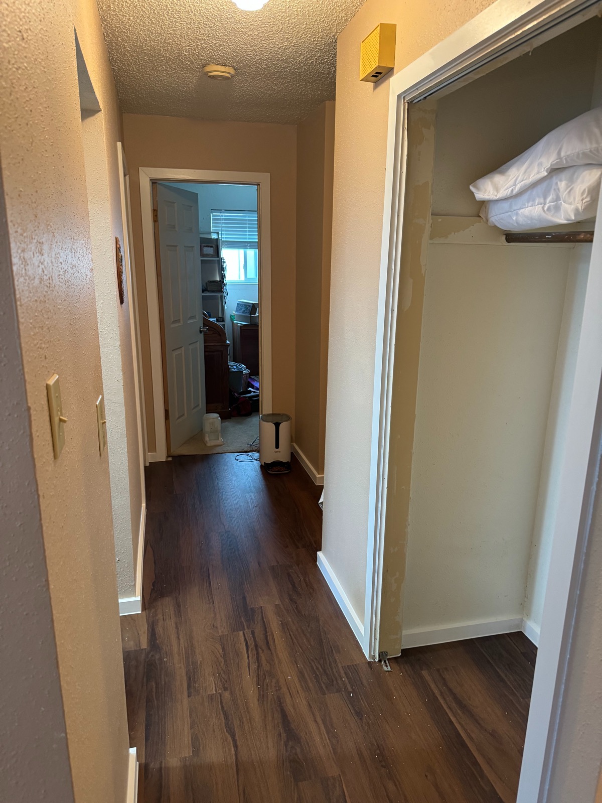 Dark walnut LVP hallway flooring Austin TX